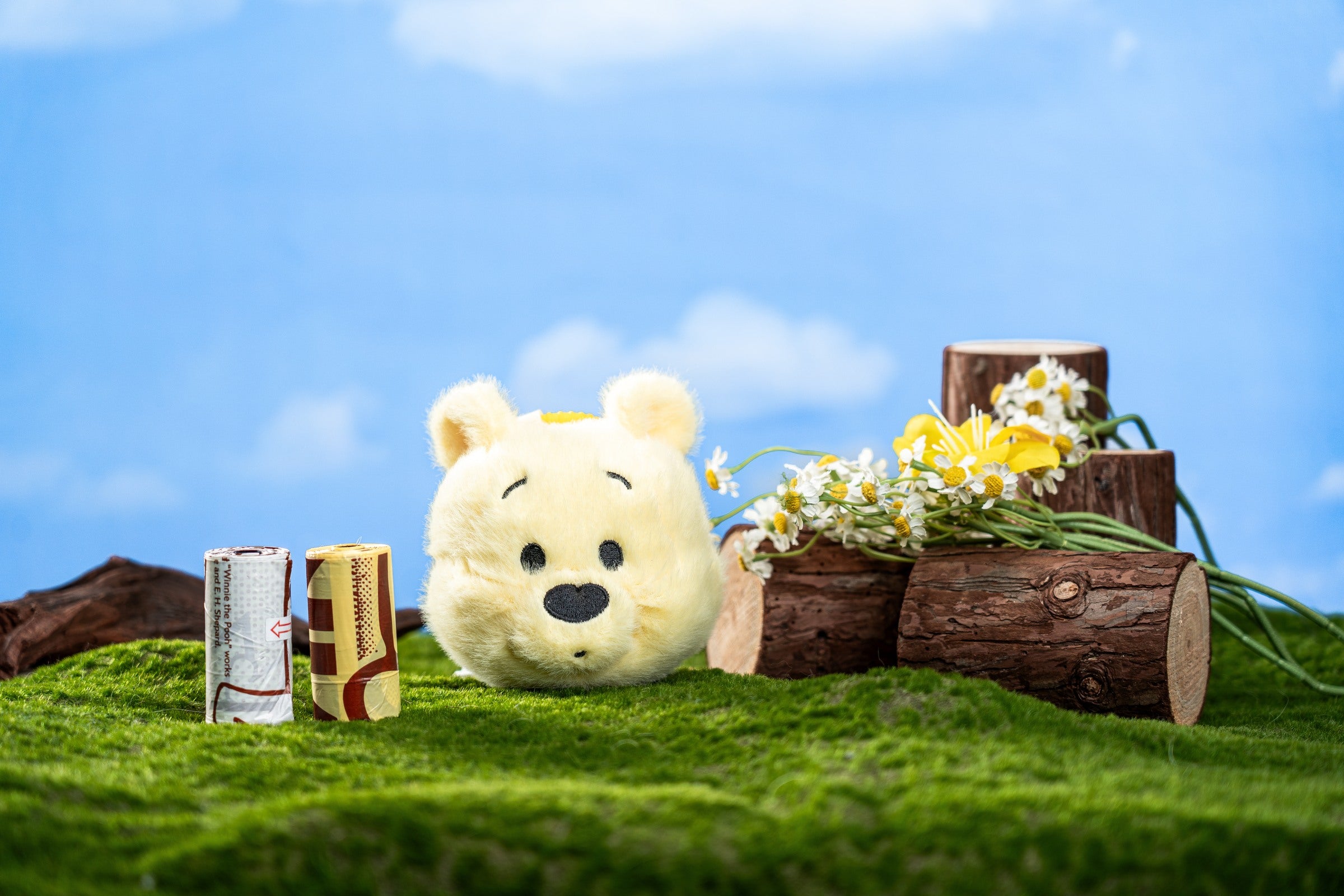 Winnie the Pooh plush waste-bag holder displayed with two printed bag rolls